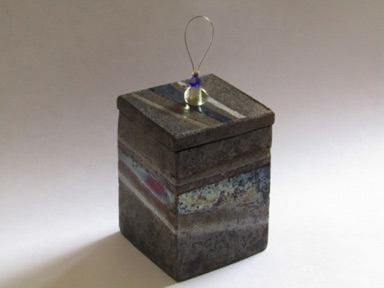 Lidded box with raku glaze